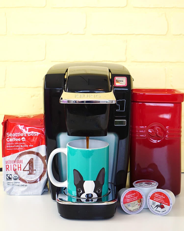 coffee mug and coffee being brewed 