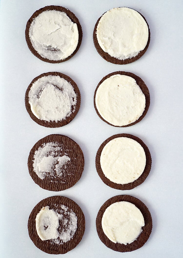 oreo sides pulled apart and lined on baking sheet 