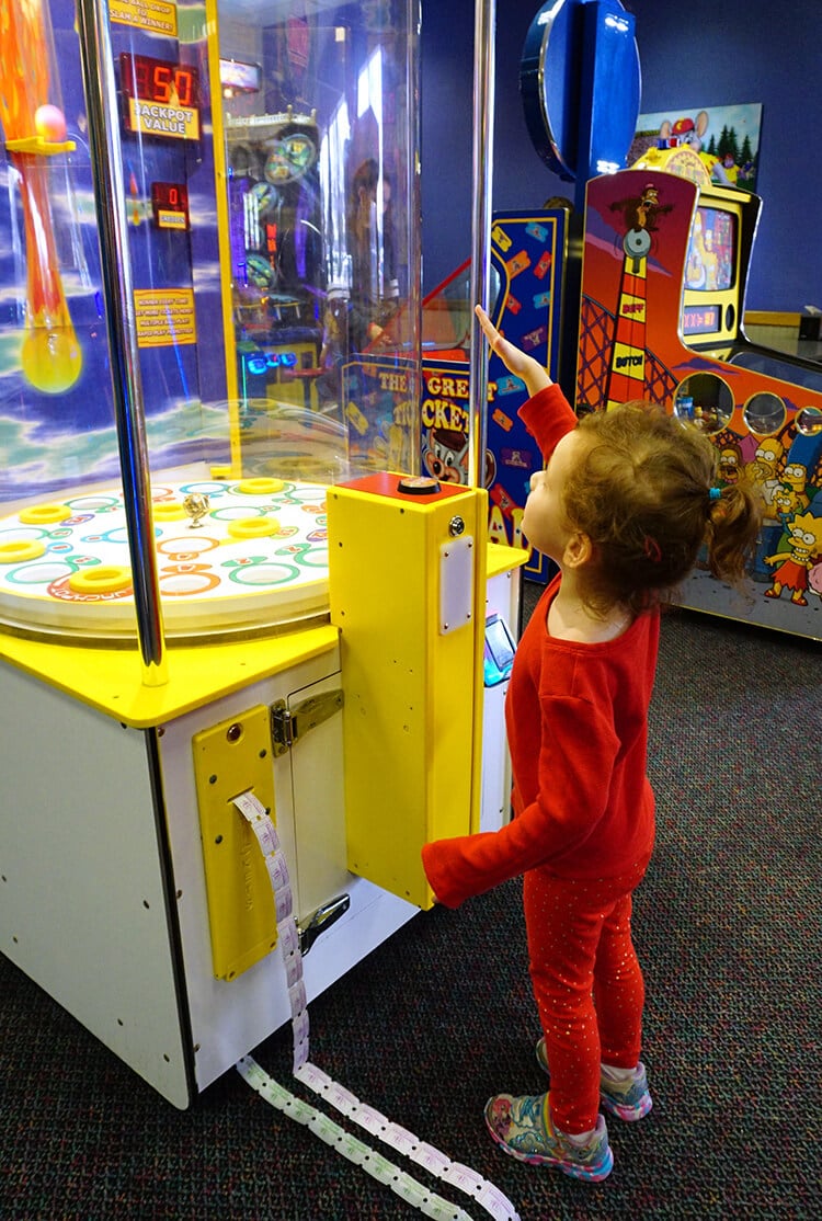 kid playing games at chuck e cheese