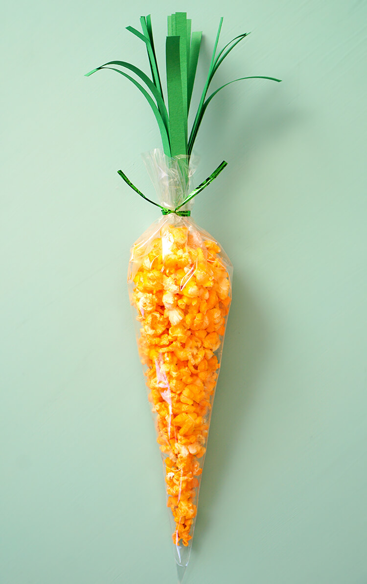 green paper strips added to carrot treat bag topper