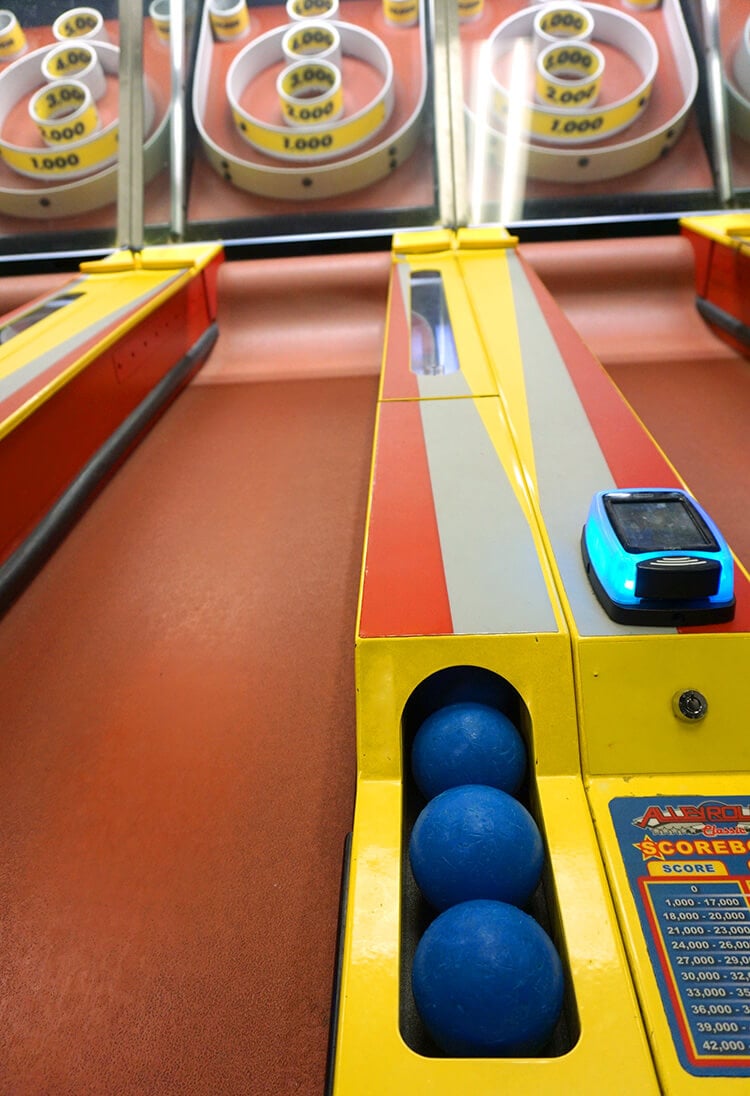 skee ball with balls lined up ready to play 