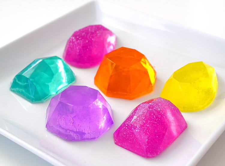 Make your own DIY Gemstone Soaps in around 10 minutes! These sparkly gem and jewel soaps are a great homemade gift idea that shimmer, shine, and smells AMAZING (in any fragrance your heart desires!)!