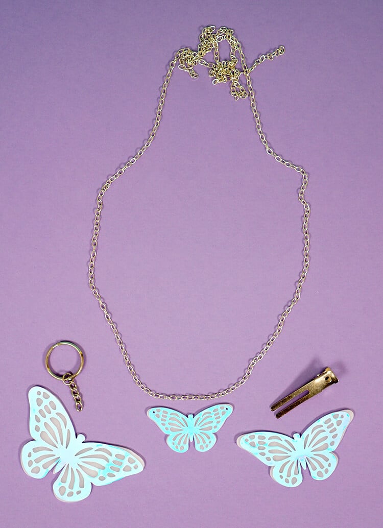 jewelry accessories next to blue butterflies