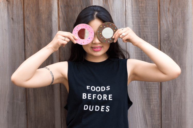 donut mirrors held up to face of girl