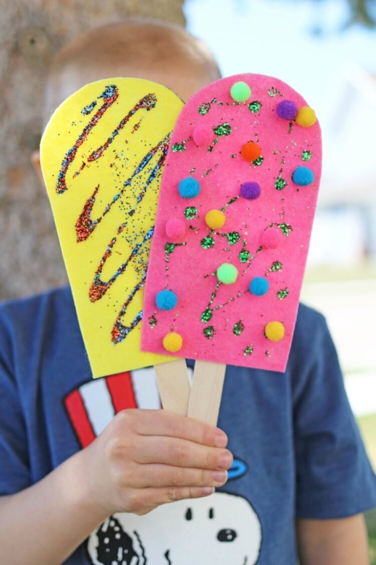 felt popsicles being held up 