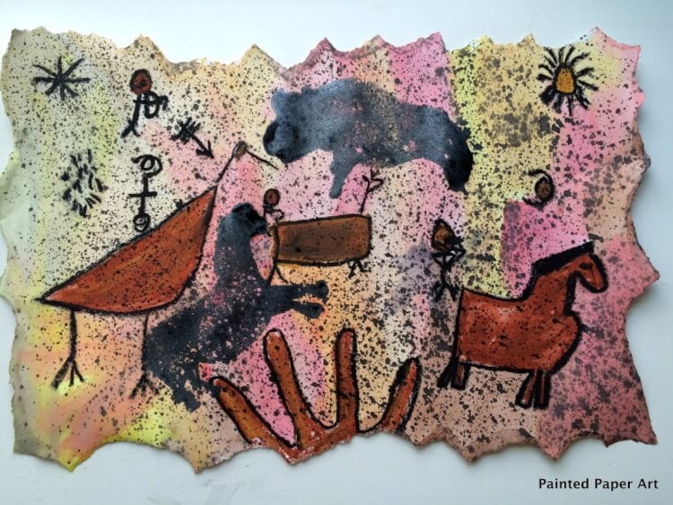 art that resembles a cave painting of horses and hands and birds