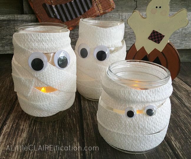 candle jars wrapped like mummies