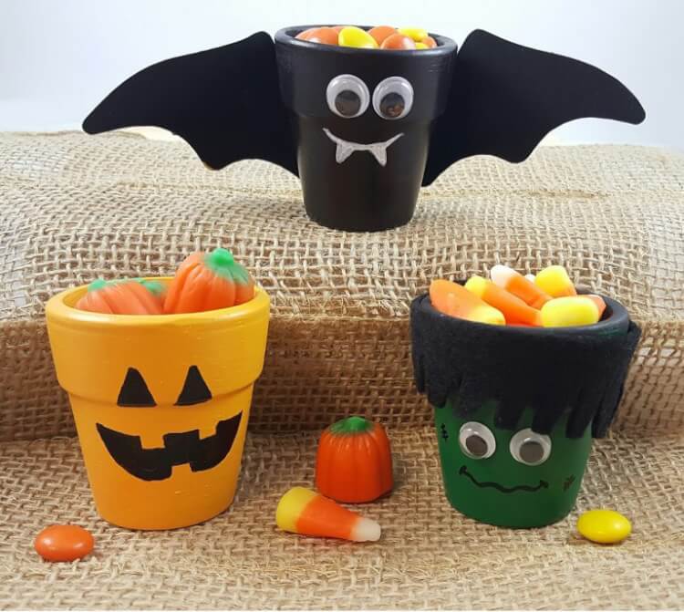 flower pots painted as bats and pumpkins