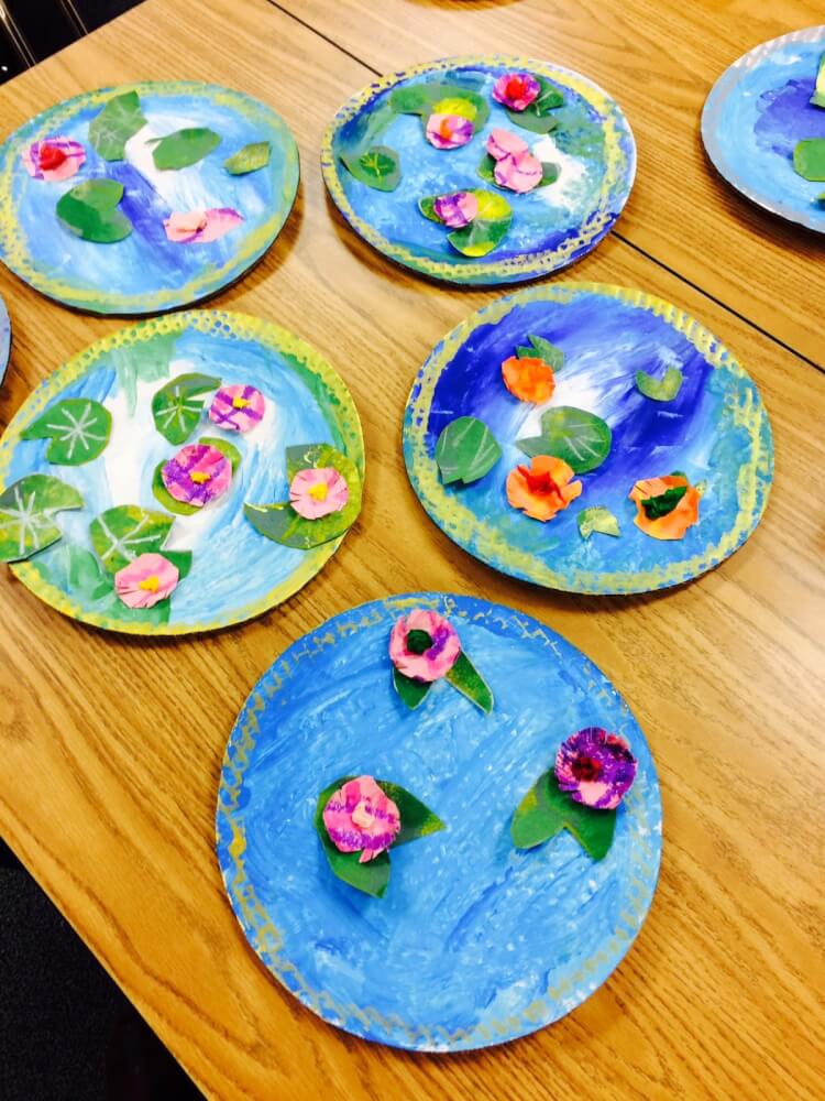 tiny ponds made from cardboard and paint on table