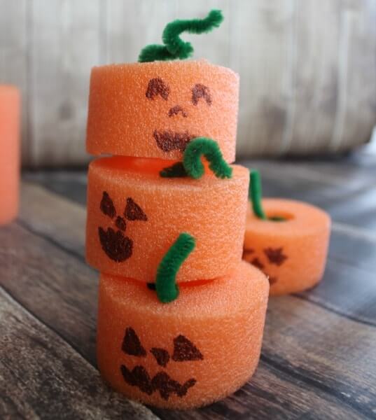 pumpkins made from orange pool noodles cut up
