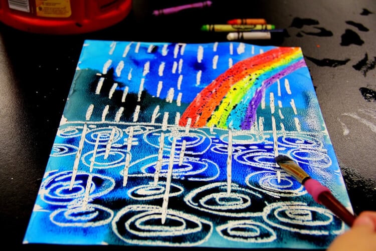 paint brush and picture of rainbow and rain drops