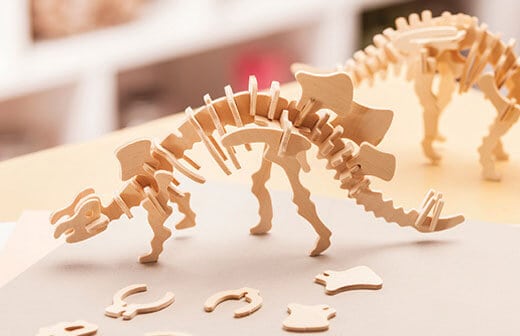 3d dinosaur bones being assembled into dinosaur