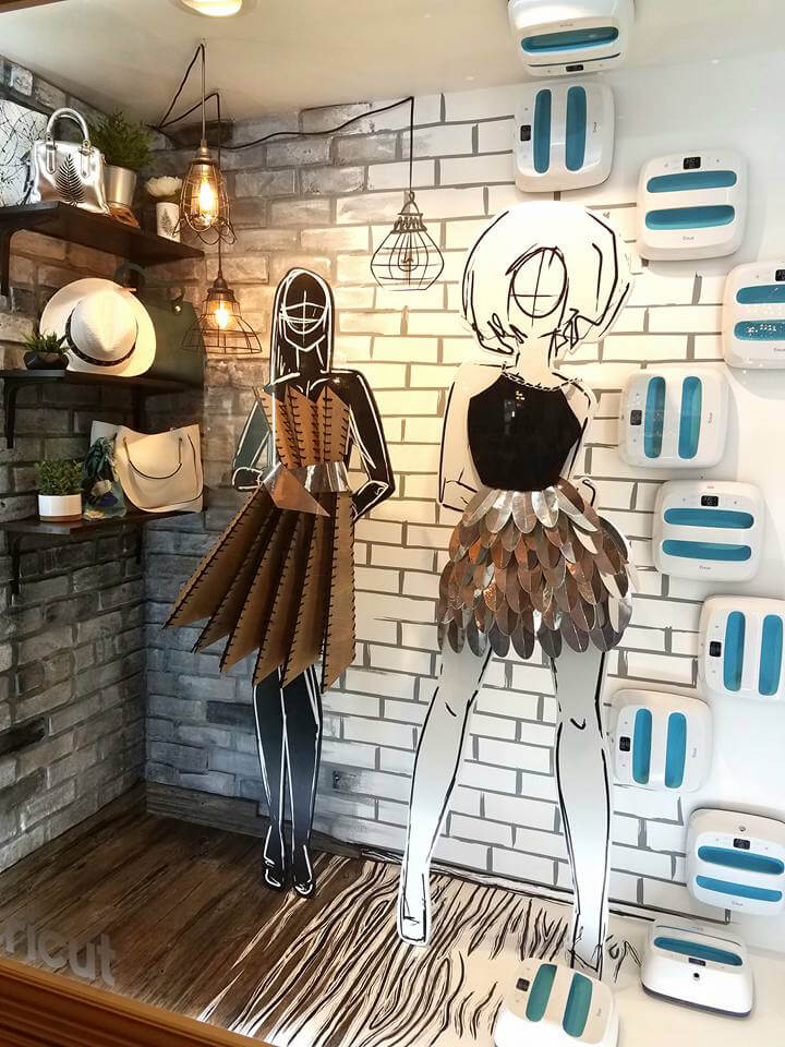 life size paper doll cutouts and cricut machines decorating wall space