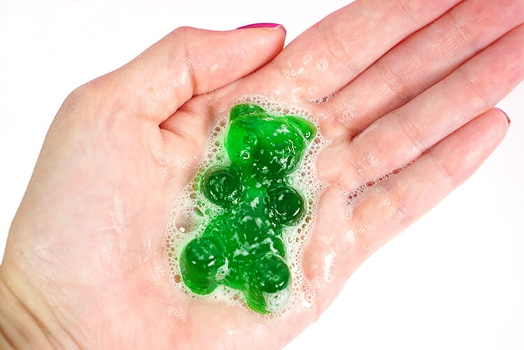 hands holding soapy gummy soap bars