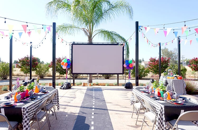 large movie screen setup in a party setting