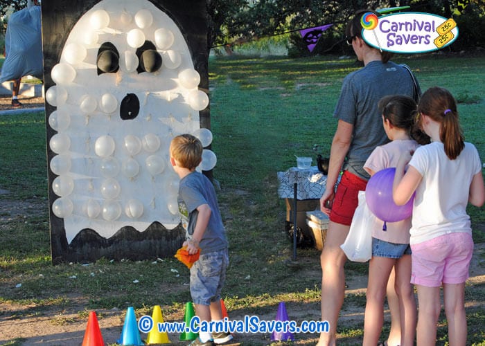 ghost balloon pop game being played by family