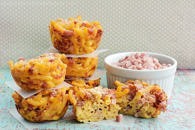 ham and mac and cheese muffins stacked up on a polka dot background