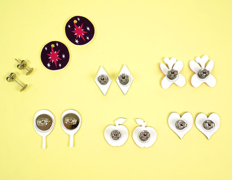 earring backs glued to shrink plastic items