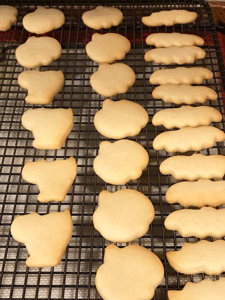 mini halloween cookies on baking sheet