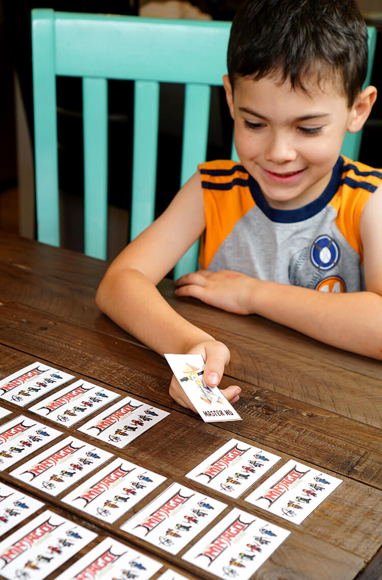 kids playing lego ninjago matching character cards