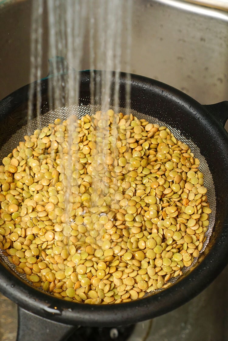 rinsing lentils off in a bowl