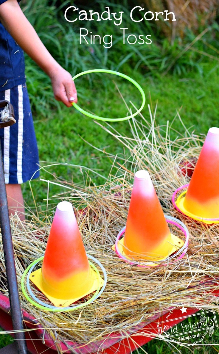 candy corn painted cones with rings being tossed on them