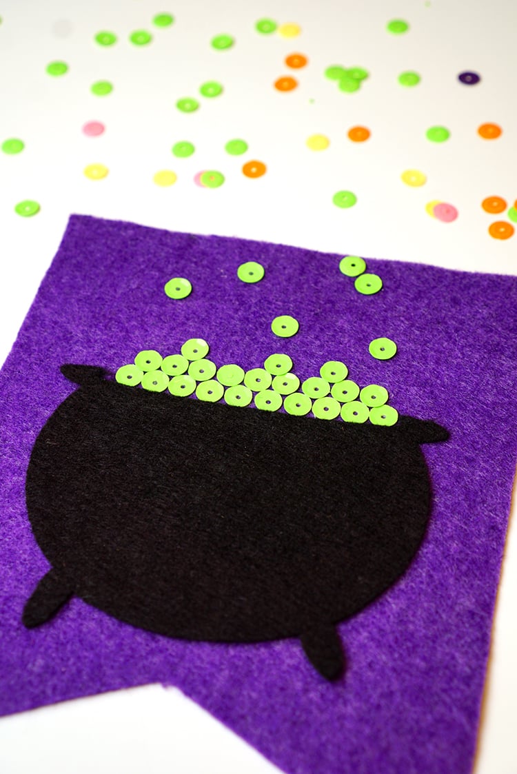 cauldron with buttons added to look like it\'s bubbling for halloween banner