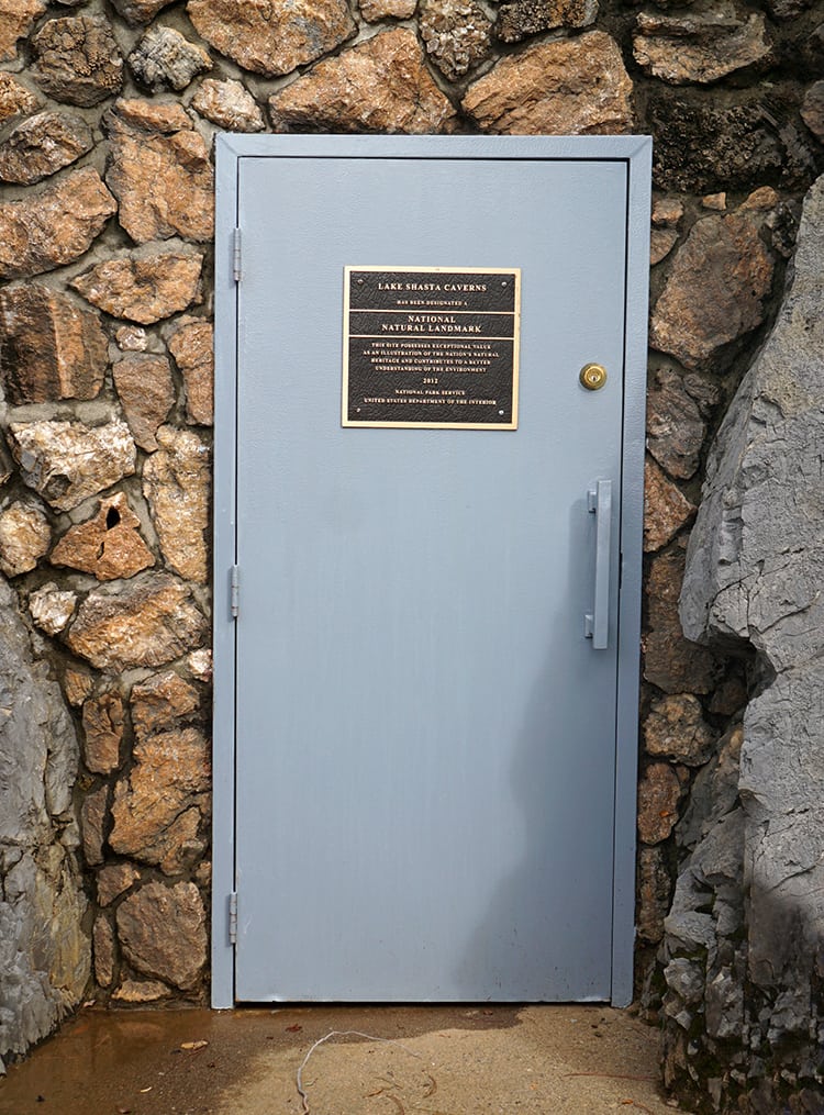lake shasta caverns national natural landmark plaque on entrance door to caverns
