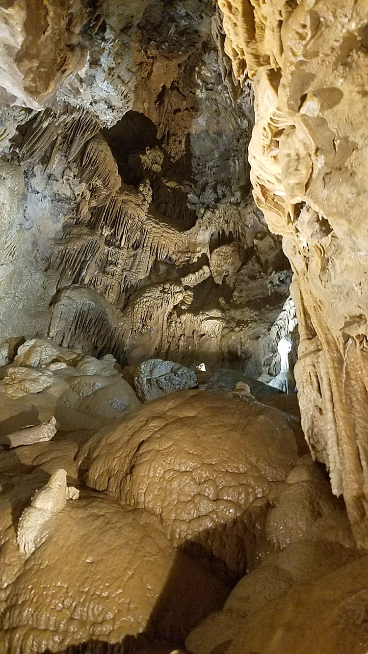 stalagmites hanging from cavern ceiling