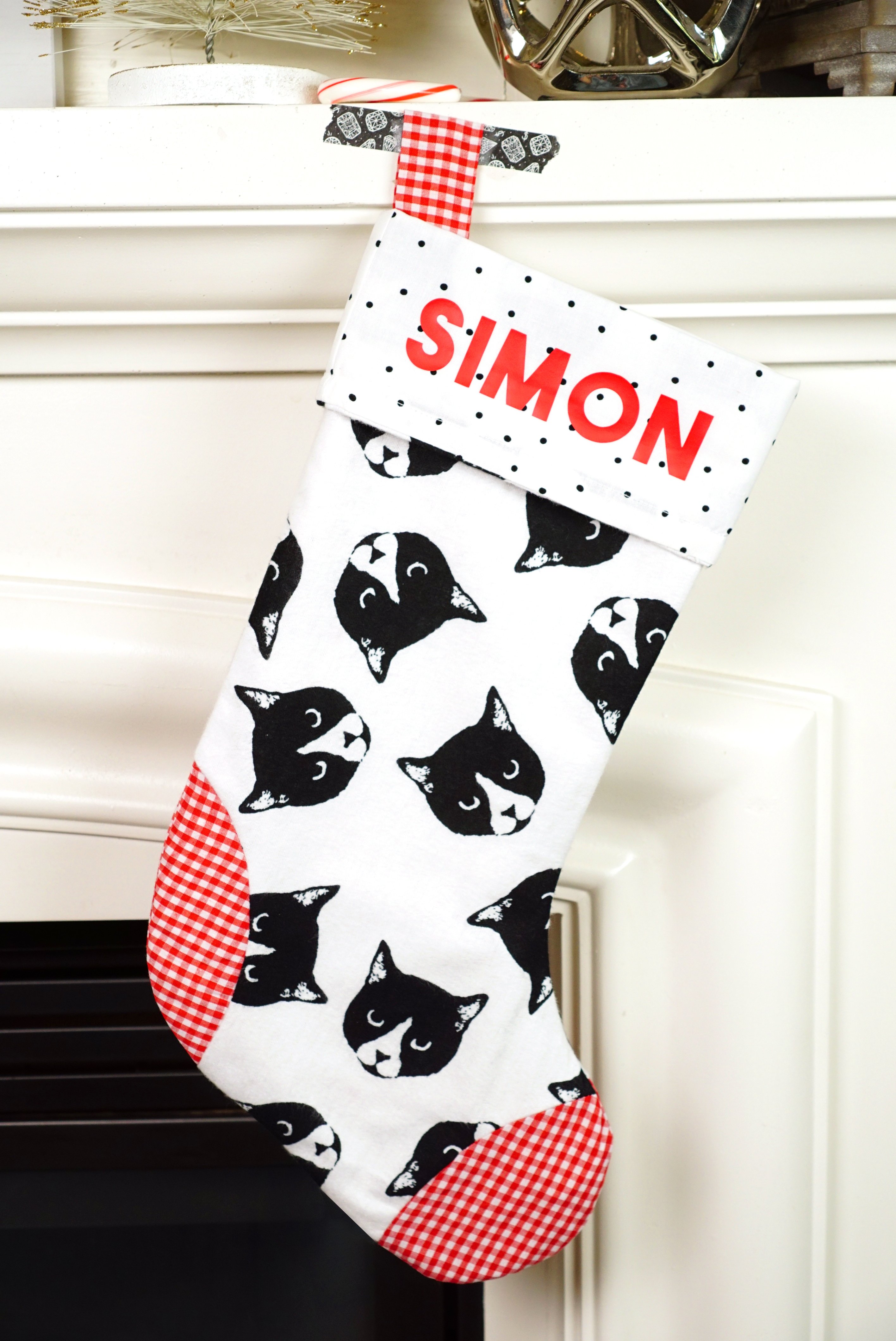 simon name on stocking with black and white kitty faces