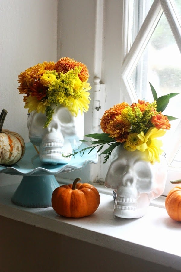 cute skull vases with halloween  fall flowers