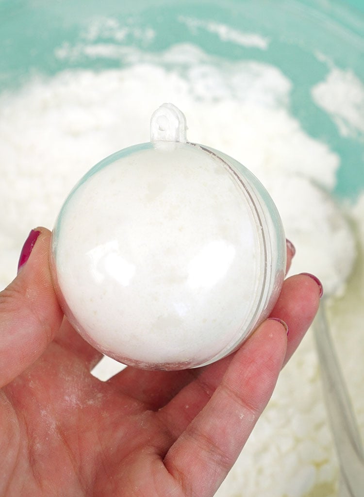 bath bomb mold enclosed around mixture 