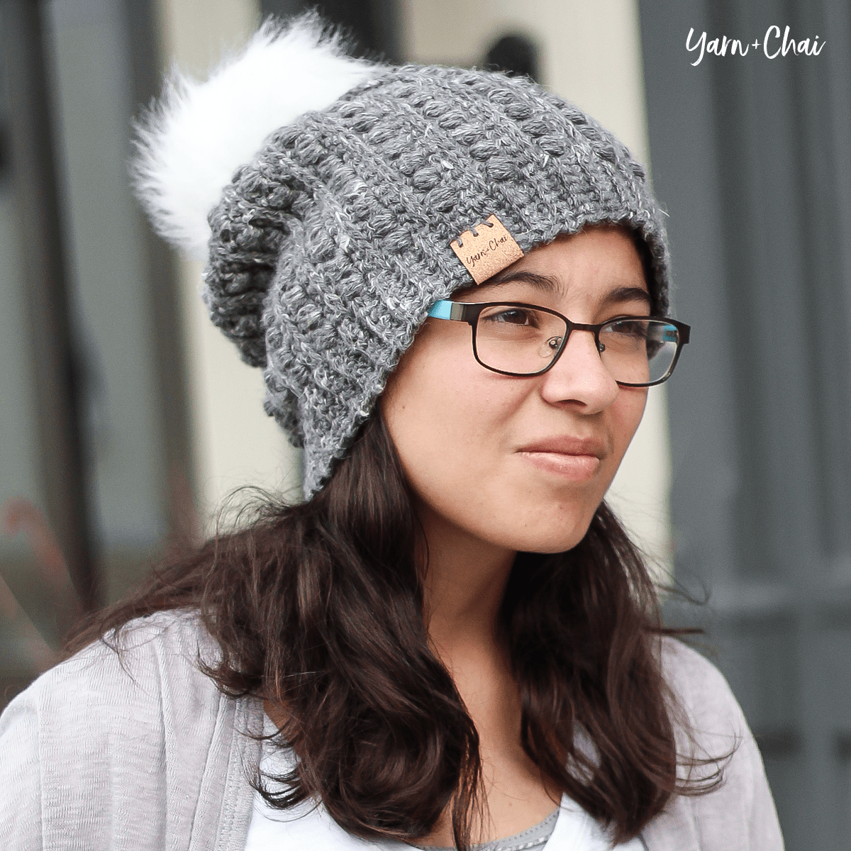 mailia slouch beanie with puff ball