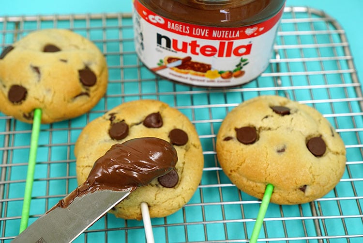 Nutella spread on knife with cookies