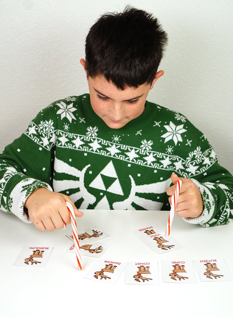 child playing minute to win it reindeer line up game