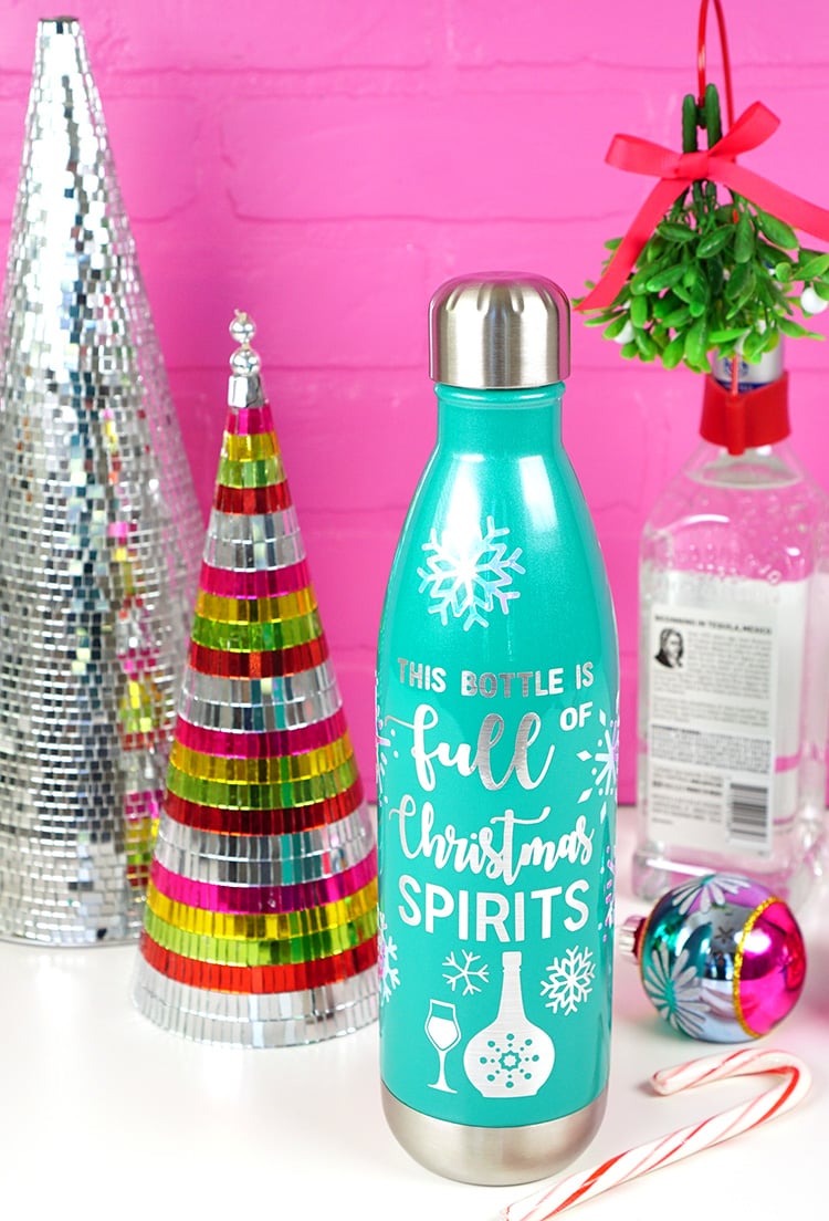 diy bottle that read full of christmas spirits in pretty christmas decor