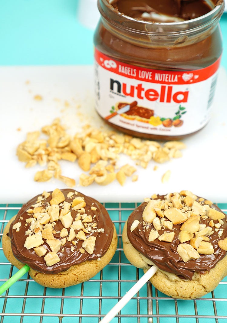 cookies covered in Nutella spread and nut clusters