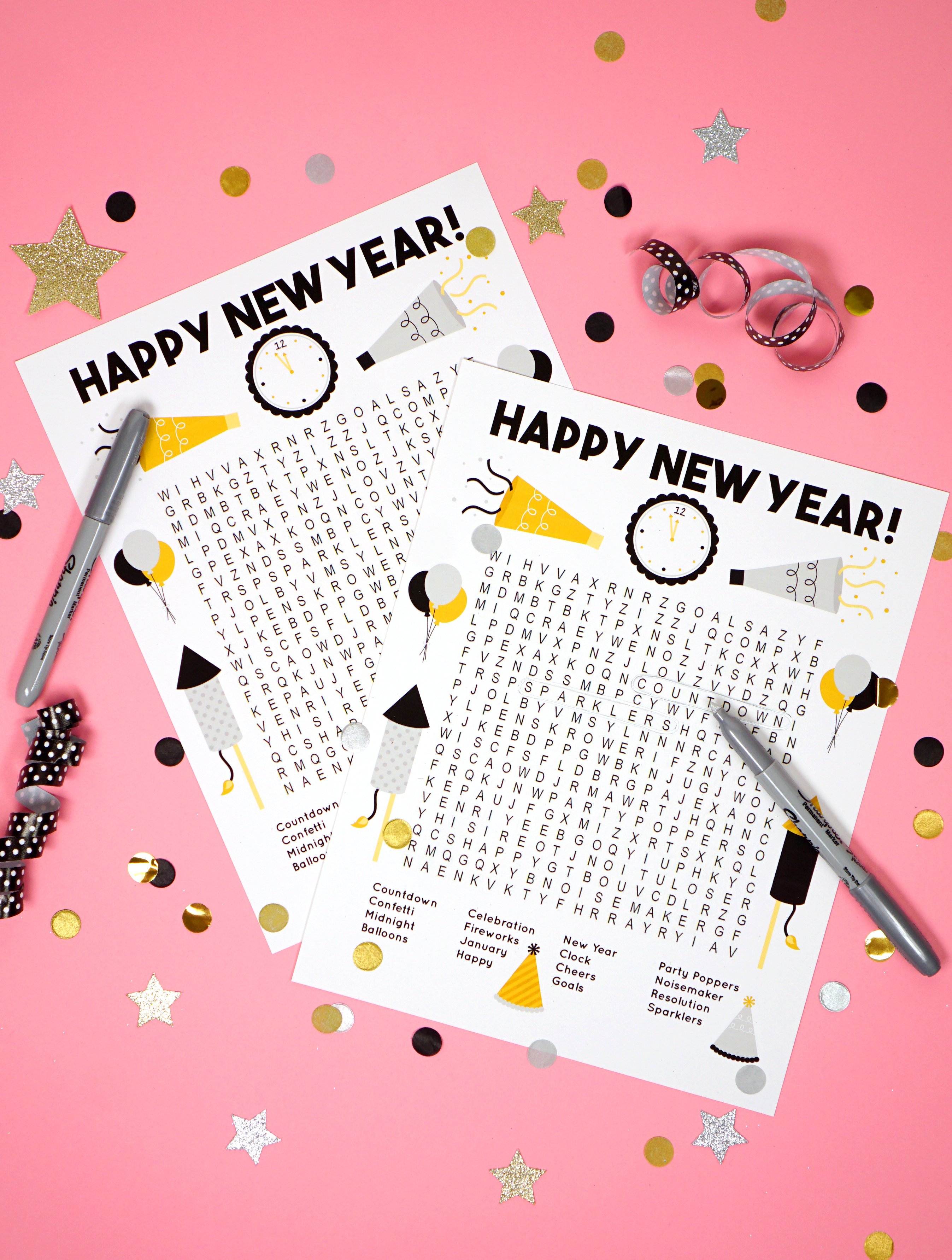 A New Years Word Search on a Pink Background With Large Confetti Peices