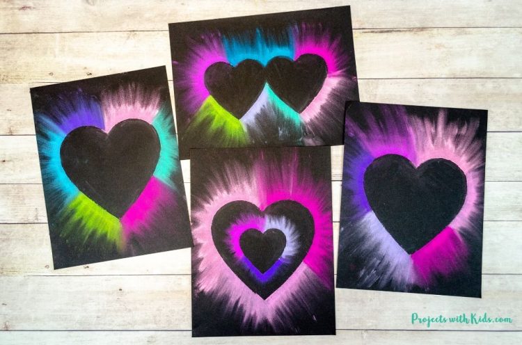 chalk pastel hearts on black paper