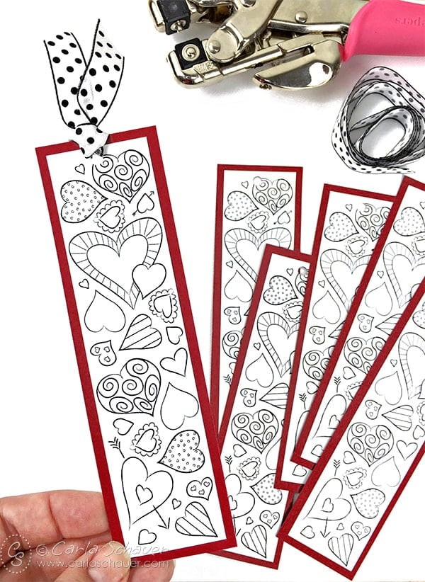 printable valentine coloring page bookmark being held 