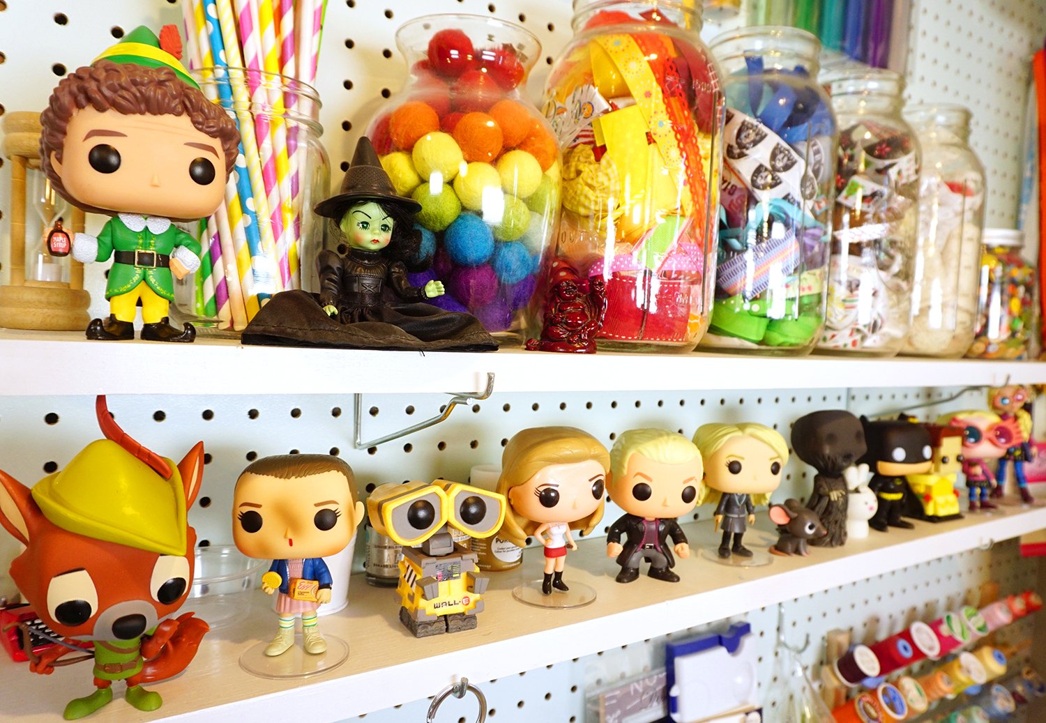 funko pops displayed on craft shelves