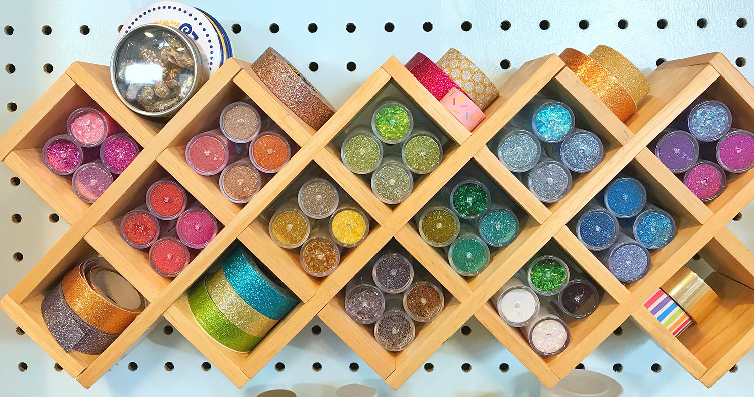 glitter storage shelf full of glitters 