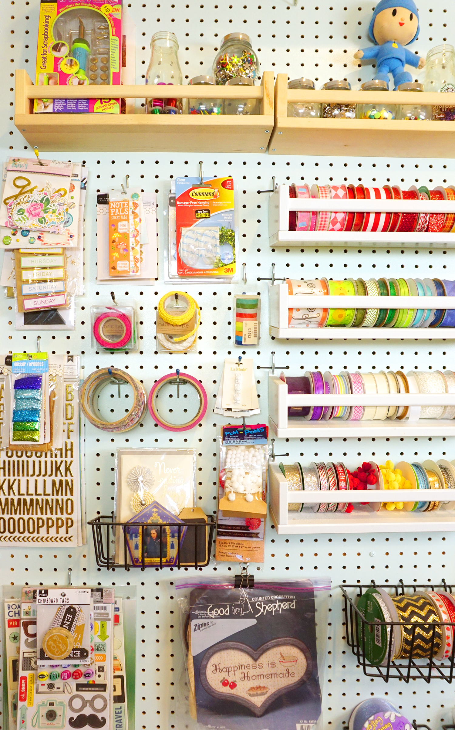 craft supplies organized on peg board