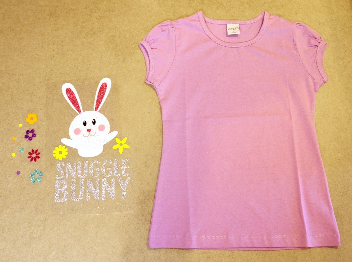 snuggle bunny svg design cut out and plain purple shirt