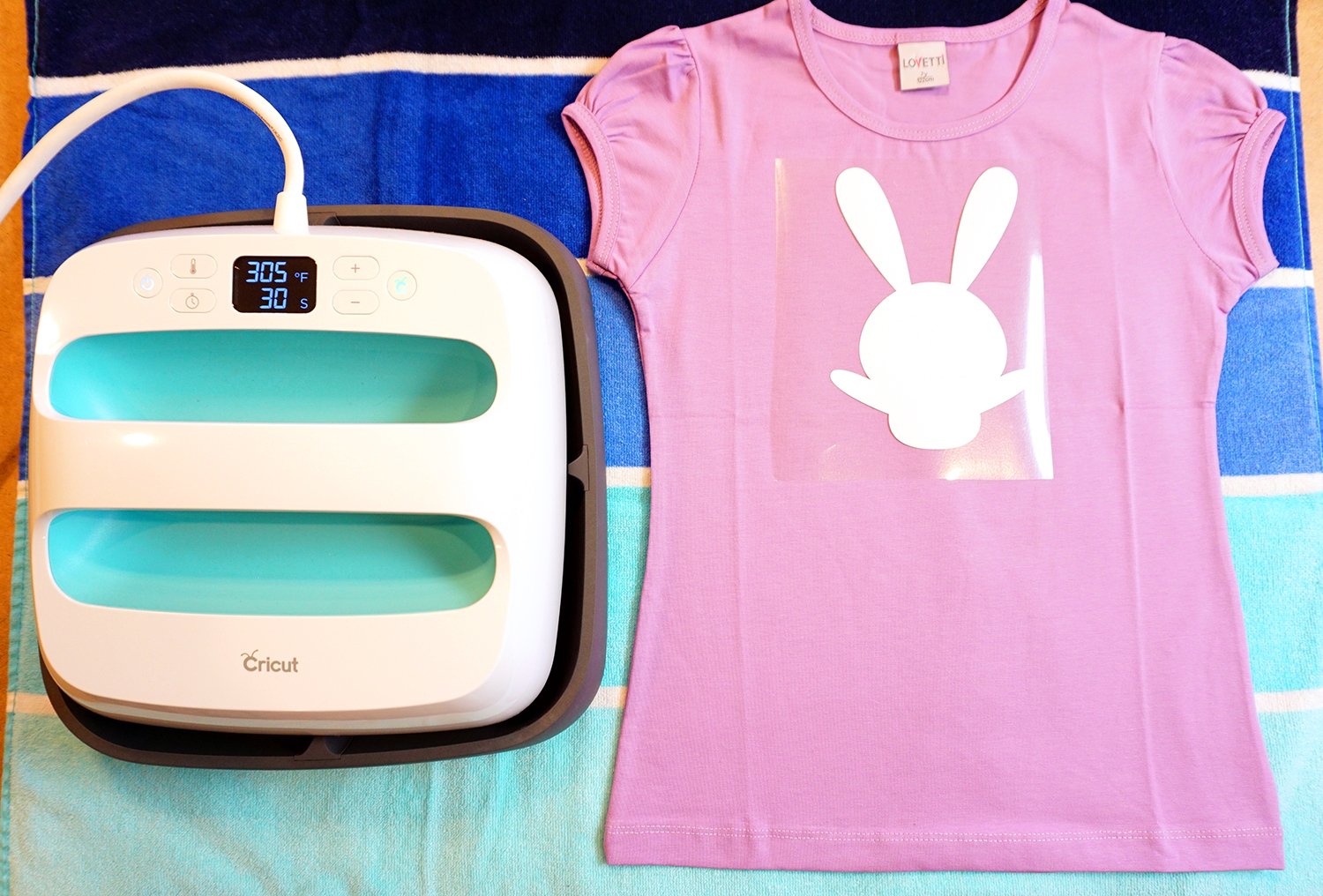 bunny template placed onto shirt next to cricut easypress machine 