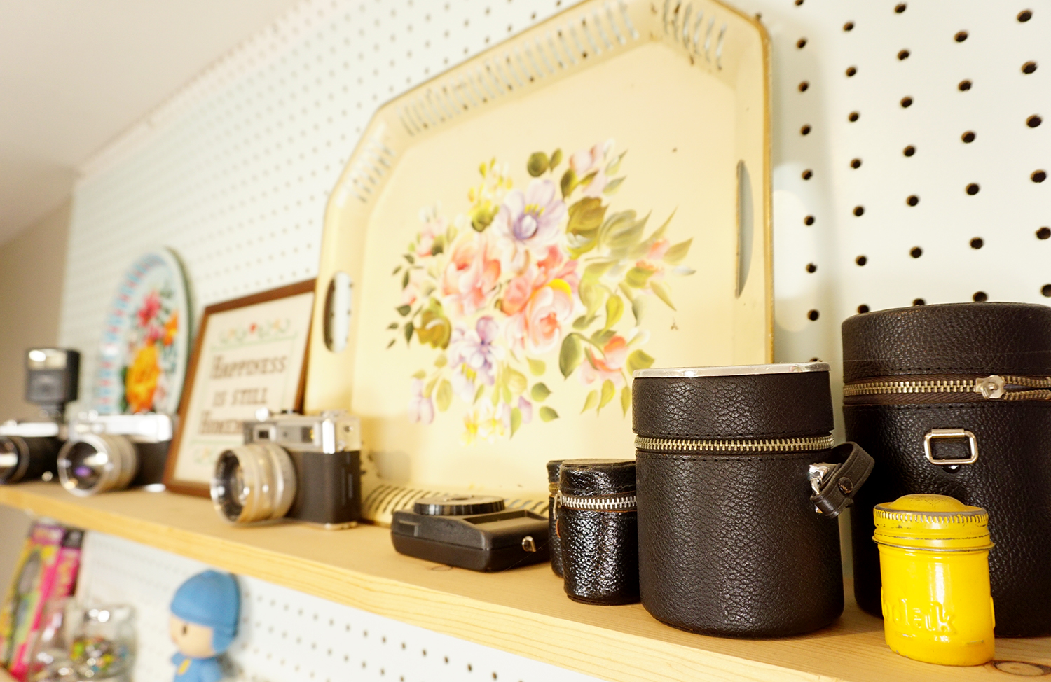 vintage camera equipment on shelf