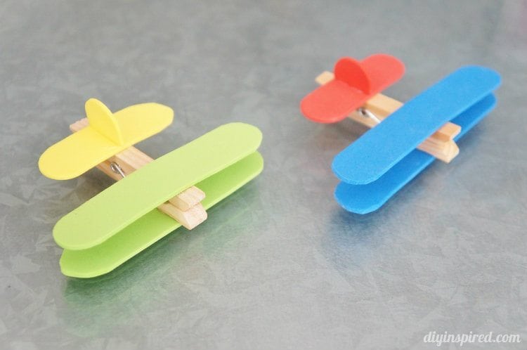 small toy planes made from clothespins and craft sticks 