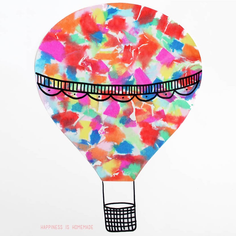 Hot air balloon kids art made with colorful bleeding tissue paper on white paper
