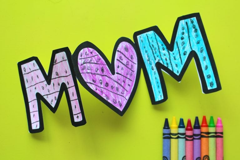 \"Mom\" sign colored in with crayons