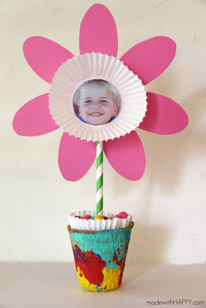 Cupcake paper craft made into a flower with children\'s photo in the center of flower
